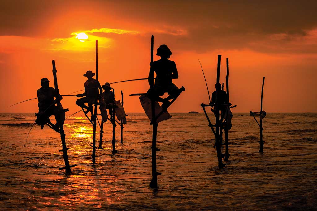 Traditional Fishermen at Sunset in Sri Lanka