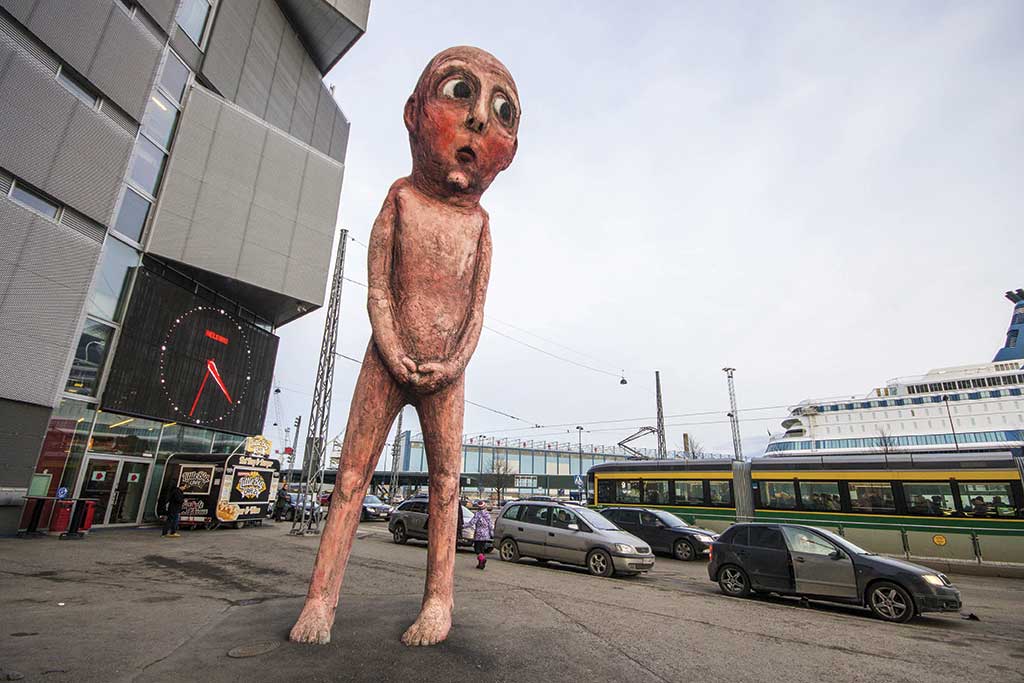 The sculpture Bad Bad Boy, a giant peeing man by artist Tommi Toija in the port of Helsinki, Finland