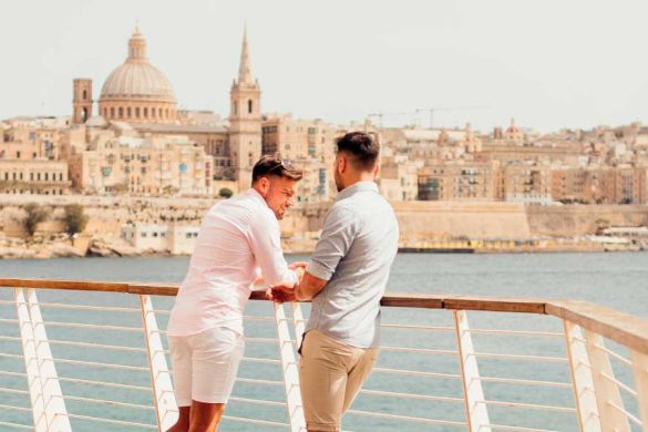 LGBT couple in Sliema, looking over to Valletta