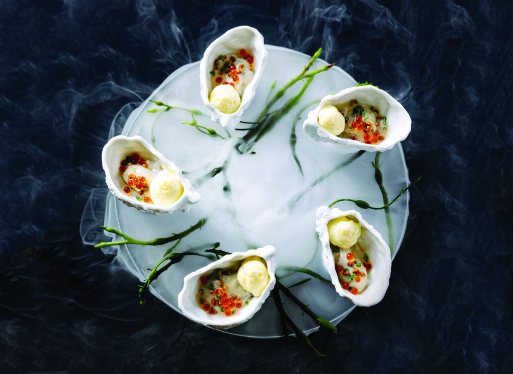 Poached Oysters With CharlestonGold Rice and Champagne Sabayon at Herons (Photo courtesy of The Umstead Hotel And Spa)