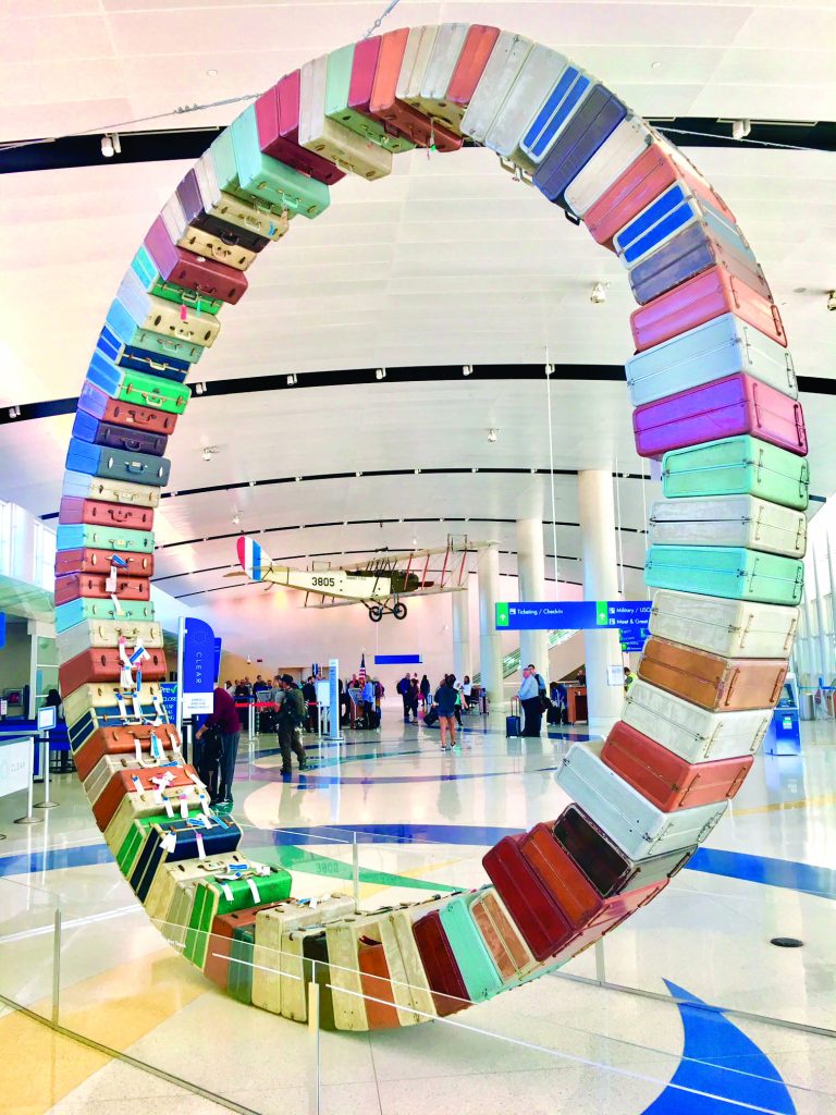 Suitcase Portaits at San Antonio AIrport (Photo by Chuck Ramirez)